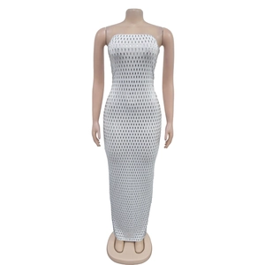 Detailed macro view of silver rectangular sequins on a white slim fit sleeveless dress