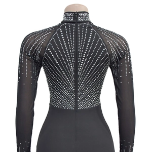 Detail view of rhinestone geometric pattern on sheer mesh back of the black dress