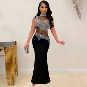 Detailed close-up of rhinestone mesh patterns on sleeveless black fishtail dress