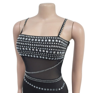 Detail of silver rhinestones and sheer mesh waist on this elegant black evening dress