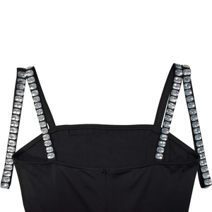 Close-up of black spaghetti straps with rhinestone diamonds and hidden back zipper