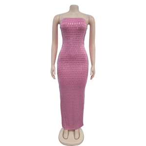 Detail of hot-fixed silver rhinestones on bright pink sleeveless maxi party dress
