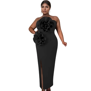 Detail of black strapless maxi dress featuring 3D floral accents and high side slit