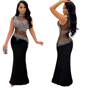 Detail of sheer mesh bodice with sparkling silver rhinestones on a black evening gown