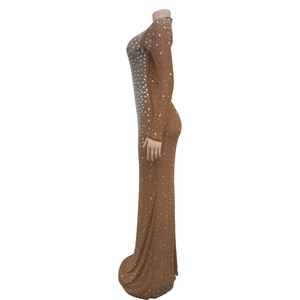 Detail of slim fit brown long sleeve maxi dress with sparkling white rhinestones