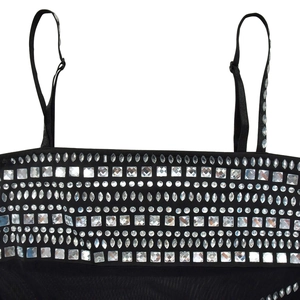 Detail of black mesh dress neckline with sparkling rhinestones and adjustable straps