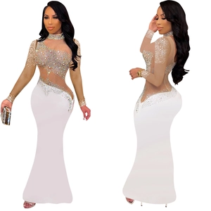 Detail of rhinestones on long-sleeve white dress with champagne mesh fishtail