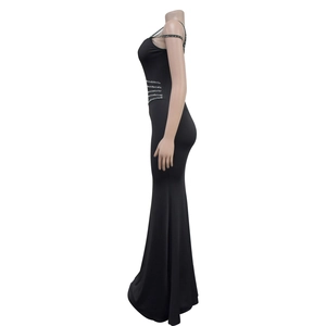 Detail view of black mermaid dress featuring sparkling rhinestone geometric accents on waist