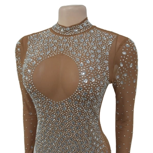 Detail of nude mesh bodysuit with sparkling silver rhinestones and keyhole cutout design