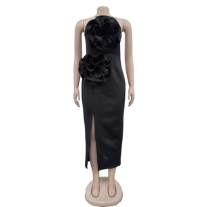Detail of elegant black strapless dress with 3D floral accents and high front slit