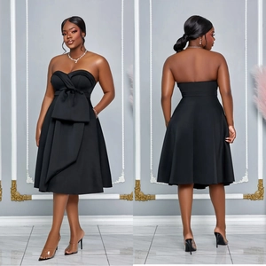 Elegant black strapless A-line midi dress with a large waist bow and side pockets