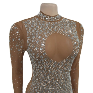 Detail of nude mesh long sleeve bodysuit with silver rhinestones and heart cut-out