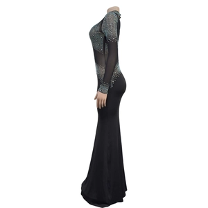 Detail view of black mermaid evening dress with rhinestones and mesh sleeves