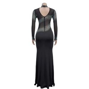 Detailed back view of a black bodycon dress with sheer mesh and silver rhinestones
