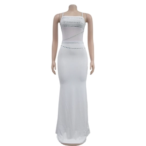 Detail of white slim evening gown featuring sparkling rhinestone bands and floor-length hem