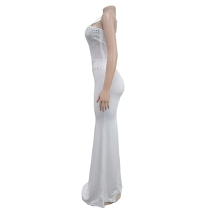 Detailed view of silver rhinestone embellishments on a white mesh fishtail evening dress