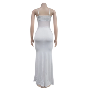 Close-up of white evening dress back detail featuring silver rhinestone straps