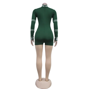 Detailed back view of dark green romper with rhinestone accents and zipper closure