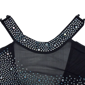 Detailed macro view of AB rhinestones on black mesh collar of a stylish women's dress