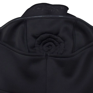 Detail of a black sleeveless dress showing the back hidden zipper and 3D floral accent