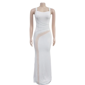 Detail of white evening dress featuring luxury rhinestone wavy lines and mesh paneling