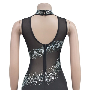 Detail of black mesh dress featuring sparkling rhinestones and a hidden back zipper