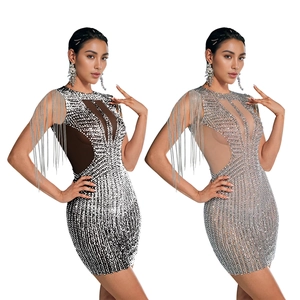 Detail of elegant sleeveless mini dresses with shimmering sequins and long fringes