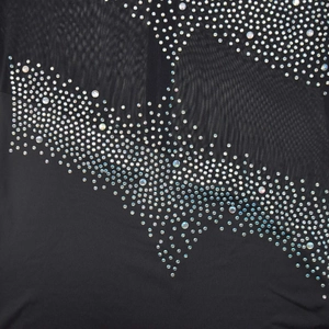 Close-up of black mesh fabric with sparkling geometric rhinestone wave patterns