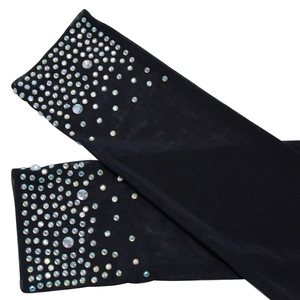 Detail of black sheer mesh arm sleeves featuring sparkling gradient rhinestone embellishments