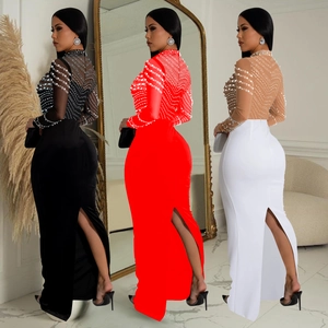 Detail of slim fit maxi evening dress featuring sheer mesh sleeves with pearl embellishments