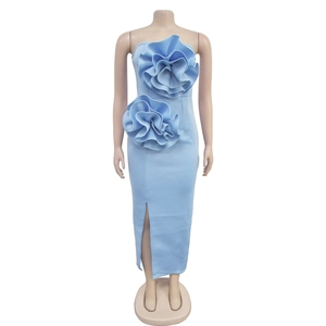 Detail of light blue strapless dress featuring 3D floral accents and a high side slit