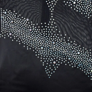 Close-up of black mesh fabric with sparkling rhinestones in a wave pattern
