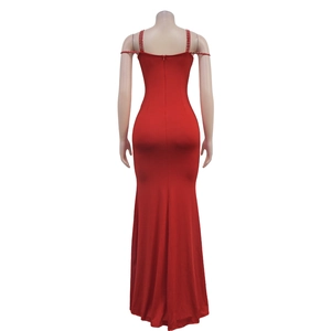 Detail of red fishtail evening dress with beaded halter straps and rhinestone accents