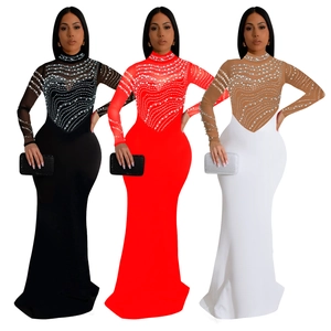 Detail of high neck long sleeve evening dress featuring intricate rhinestone wave patterns