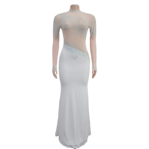 Detail of luxury rhinestones on a fishtail evening dress with sheer mesh neckline