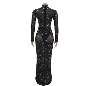 Close-up of sheer black mesh dress featuring dense sparkling rhinestones and slim fit