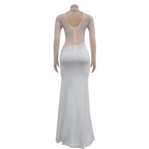 Close-up of white slim fit gown with rhinestones on sheer mesh and deep V back