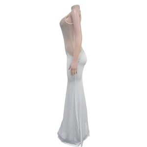 Detail of white mermaid dress showing rhinestone mesh bodice and fitted silhouette