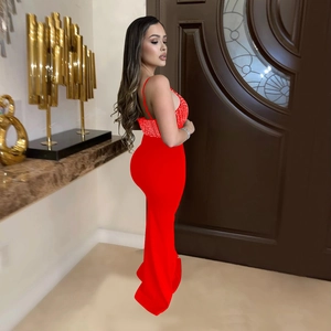 Detail of red sleeveless maxi dress with rhinestones and fishtail hemline