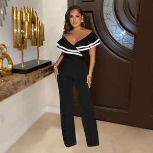 Detail of elegant black off-the-shoulder jumpsuit with striped ruffle and wide leg cut