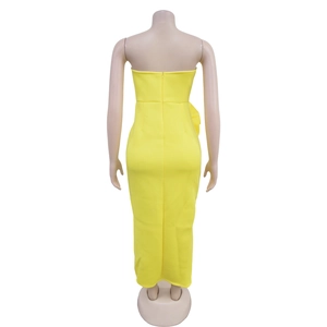 Back view of a yellow strapless bodycon dress featuring a sleek zipper and slit hemline