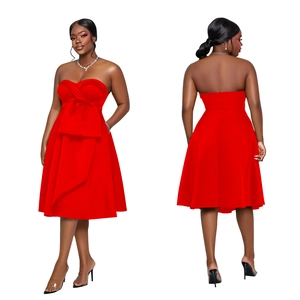 Detailed view of red strapless dress featuring a large bow and elegant A-line silhouette