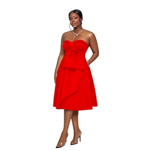 Detailed view of red strapless knee-length cocktail dress with large bow on waist