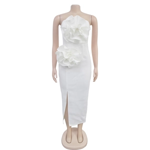 Detail of elegant white strapless dress featuring 3D floral accents and front slit detail
