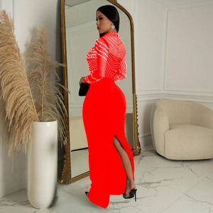 Detail view of red long sleeve dress featuring rhinestone mesh and back slit design