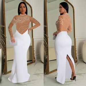 Elegant white rhinestone evening dress with sheer mesh bodice and high slit detail
