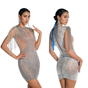 Detailed views of silver sequin mini dress with fringe and mesh patchwork design