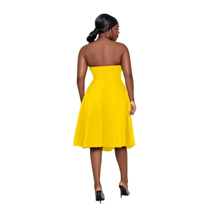 Rear view detail of bright yellow sleeveless midi dress showing fit and fabric texture
