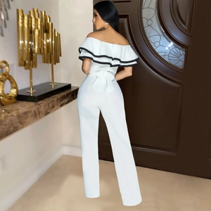 Detailed back view of white off-shoulder jumpsuit featuring large ruffled trim and bow