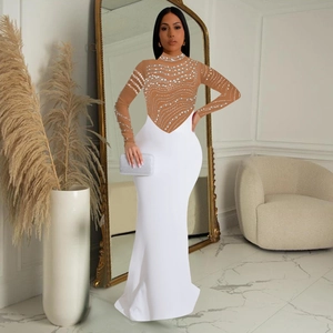 Detail of evening dress with rhinestone sheer mesh top and white floor-length fishtail skirt